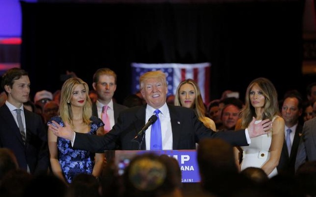 Republican US presidential candidate Donald Trump speaks as his son-in-law Jared Kushner his daughter Ivanka his son Eric Eric's wife Lara Yunaska and Trump's wife Melania look on during a campaign victory party after rival candidate Senator Ted