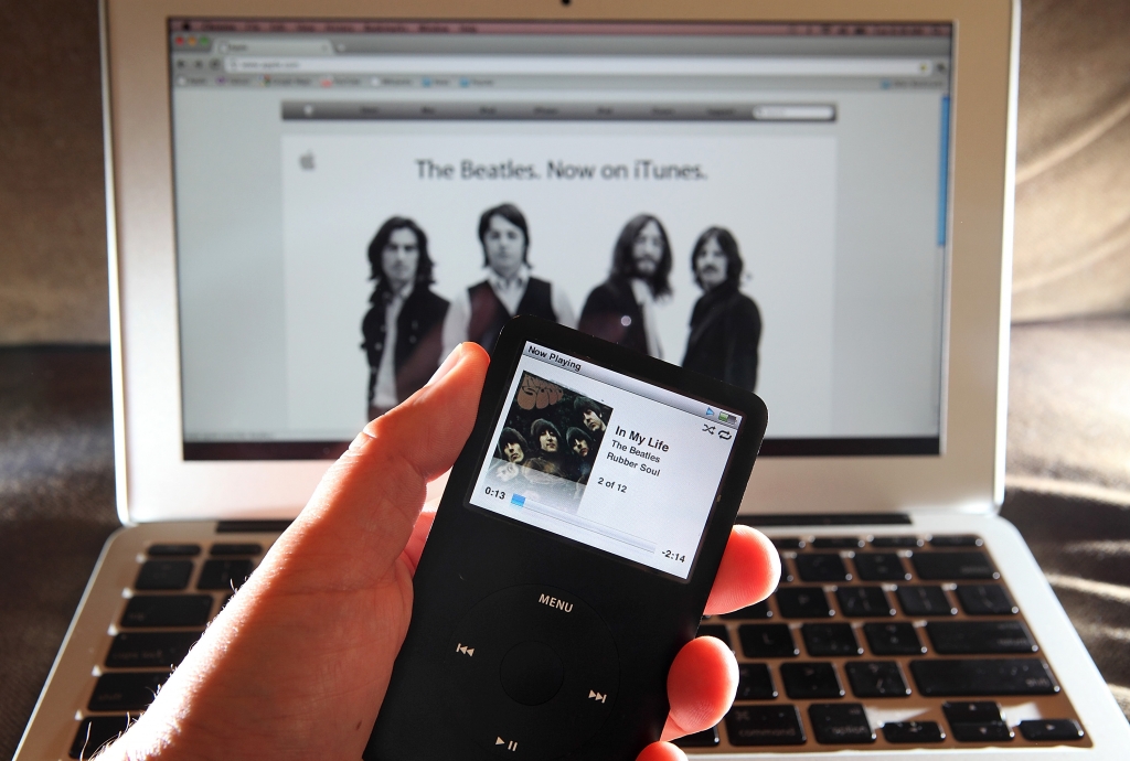 A Beatles song plays on an iPod