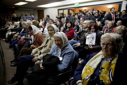 People sit in federal court for the sentencing of former military officers in Buenos Aires Argentina Friday