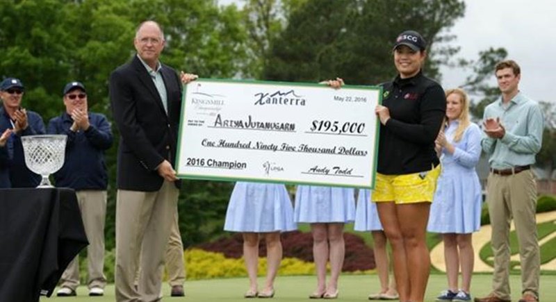 Ariya Jutanugarn is presented with a cheque by Wayne Nooe after winning the Kingsmill Championship presented by JTBC on the River Course at Kingsmill Resort yesterday