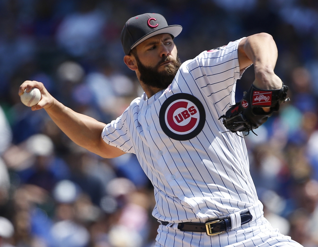 Chicago Cubs starter Jake Arrieta throws against the Washington Nationals during the first inning of a baseball game Sunday