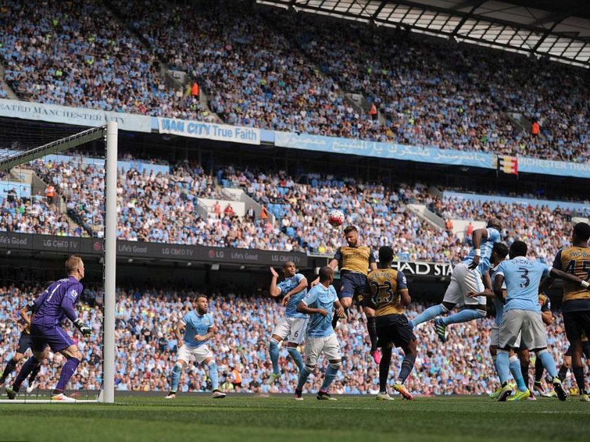 Arsenal striker Giroud rises highest to level the scores at the Etihad Stadium after powering his header past the helpless Joe Hart