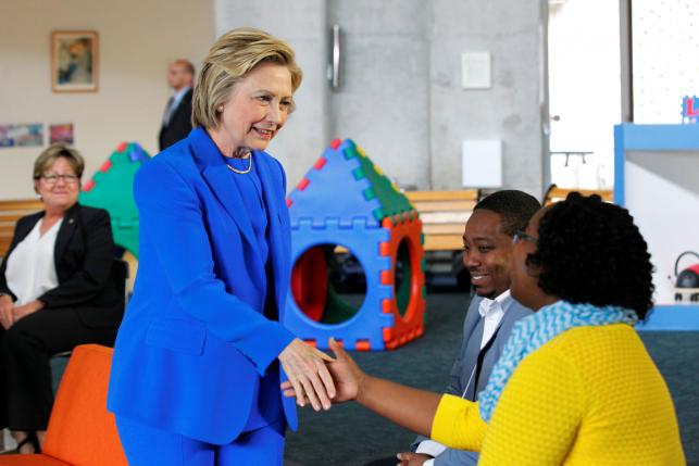 U.S. Democratic presidential candidate Hillary Clinton shakes hands with parents during a campaign event'Conversation with Young Parents in the Workforce at The Family Care Center in Lexington Kentucky U.S