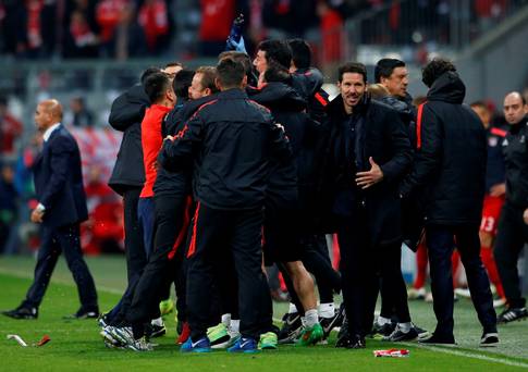 Atletico Madrid coach Diego Simeone celebrates after the game