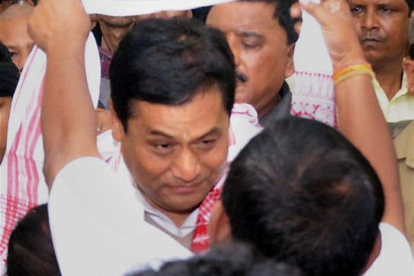 Guwahati BJPs Chief Ministerial Candidate Sarbanada Sonowal is greeted on his arrival for a meeting with the newly elected party Legislators at the party office Hengrabari in Guwahati on Friday. PTI