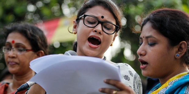 Bangladeshi teachers students and social activists hold banners and sing songs during a protest against the killing of a university professor in Dhaka Bangladesh last month