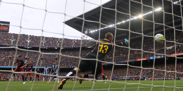 Barcelona closed in on the La Liga title by thrashing local rivals Espanyol 5-0 yesterday