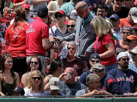 Medical personnel attended to an injured fan at Fenway Park