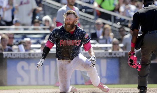 San Diego Padres&#039 Andrew Cashner reacts after being called out at home during the fifth inning of a baseball game against the New York Mets Sunday