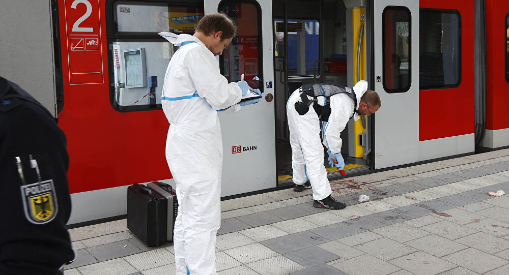 Police investigate the scene of a stabbing at a station in Grafing near Munich Germany Tuesday