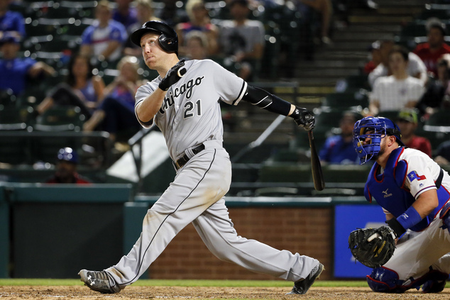 Chicago White Sox's Todd Frazier follows through on a grand slam swing on a pitch from Texas Rangers Cesar Ramos in the 12th inning of a baseball game Mond