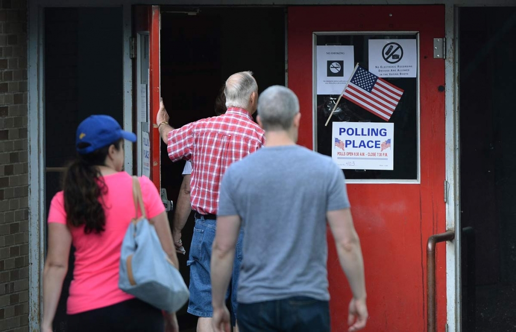 Voters enter their polling place at Stonewall Jackson Middle School in the West Side neighborhood of Charleston