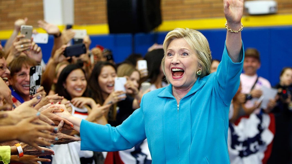 Democratic presidential candidate Hillary Clinton reacts as she arrives at a rally at the University of California Riverside Tuesday