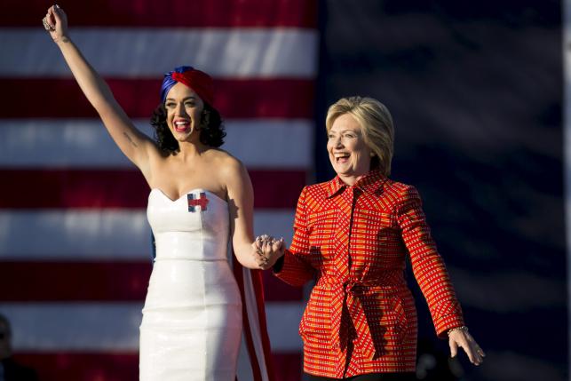 Democratic presidential candidate Hillary Clinton arrives with singer Katy Perry during a campaign rally in Des Moines Iowa