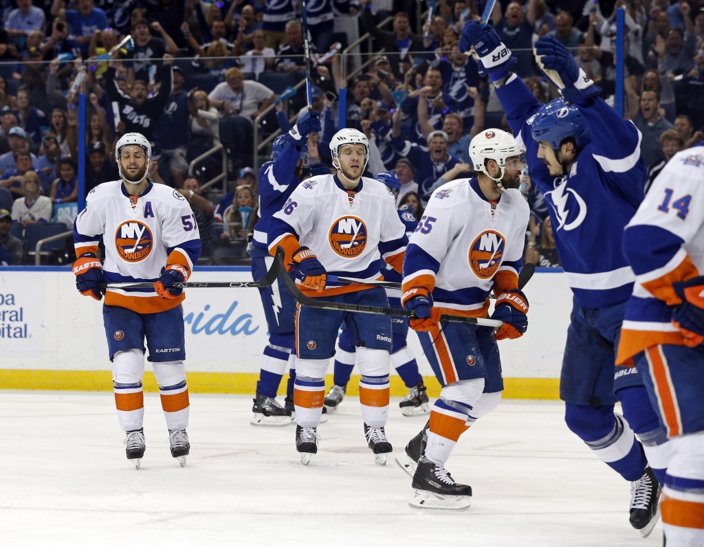 New York Islanders players react after the Tampa Bay Lightning score during the second period of Game Five of the Stanley Cup playoffs