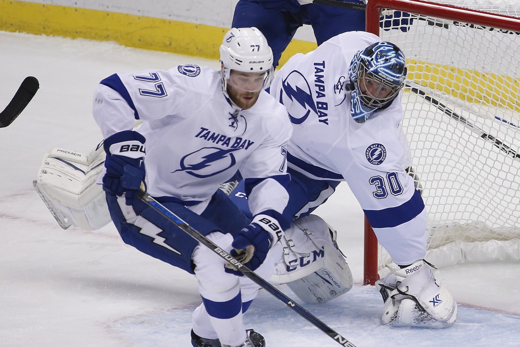 Tampa Bay Lightning goalie Ben Bishop twists his leg as he is injured during the first period of Game 1 against the Pittsburgh Penguins in the Stanley Cup Eastern Conference finals Friday in Pittsburgh.
The Associated Press