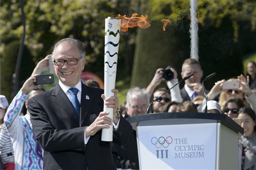 Carlos Arthur Nuzman Brazil's Olympic Committee President poses with the torch during the Olympic flame welcoming ceremony at the Olympic Museum in Lausanne Switzerland Friday