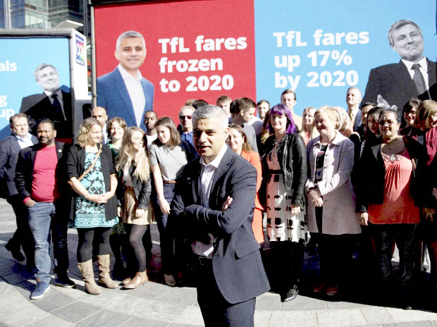 Britain's Labour party candidate for Mayor of London Sadiq Khan watched by Labour Party supporters