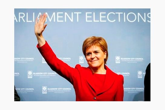 Scottish National Party leader Nicola Sturgeon celebrates after retaining her seat at a Scottish Parliament election count in Glasgow Scotland Friday