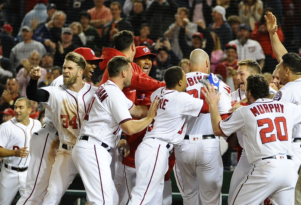 Washington DC USA Washington Nationals right fielder Bryce Harper reacts towards home plate umpire Brian Knight as first baseman Clint Robinson is greeted by teammates after hitting walk off homer against the Detro