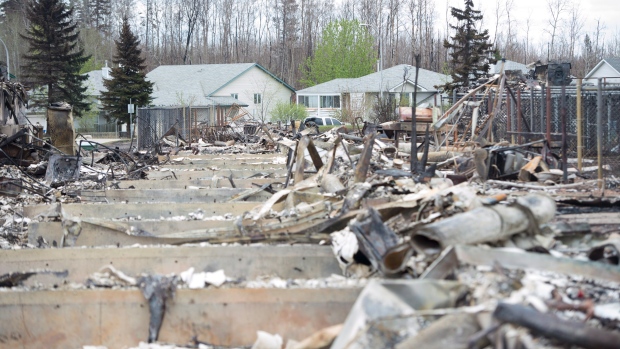 Burned out homes are surrounded by other homes untouched by wildfire in Fort McMurray