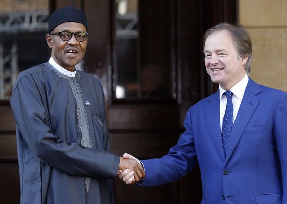 Buhari is welcomed by Minister of State for the Foreign and Commonwealth Office Hugo Swire as he arrives for the Anti Corruption Summit in London Thursday