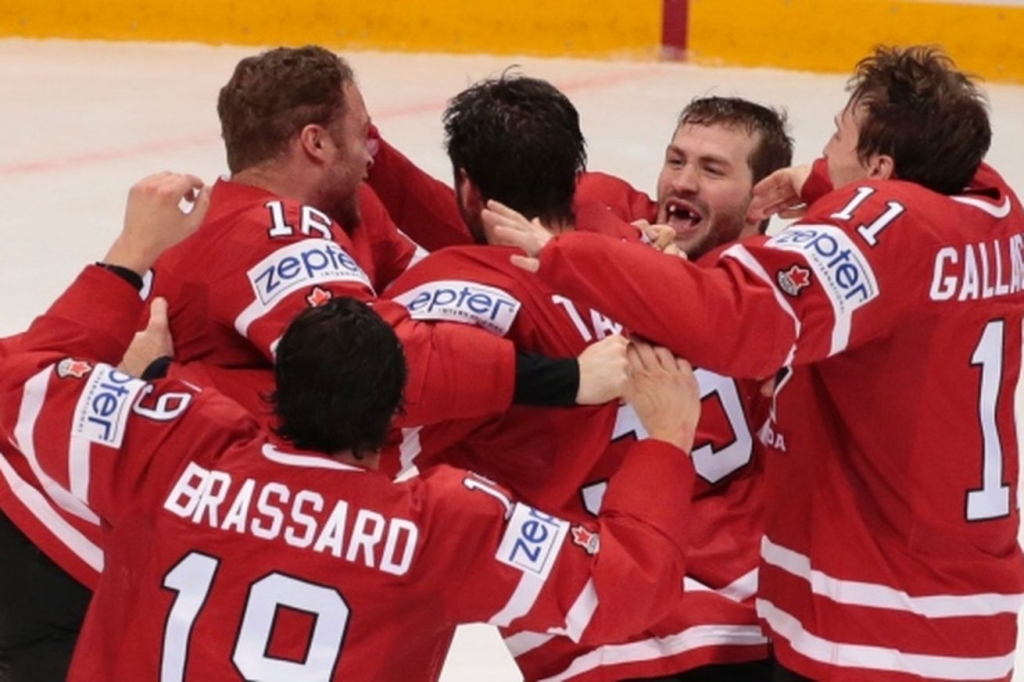 Canada celebrates winning the tournament- The Canadian Press