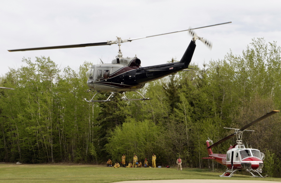 Cooler temperatures, rain give firefighters hope in Canada