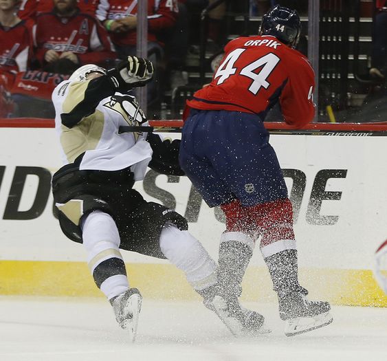 Brooks Orpik levels Pittsburgh Penguins defenseman Olli Maatta with a high hit during the first period of Game 2 in an NHL hockey Stanley Cup Eastern Conference semifinal series Saturday