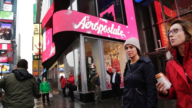 People pass an Aeropostale clothing store in New York's Times Square in this December 2015