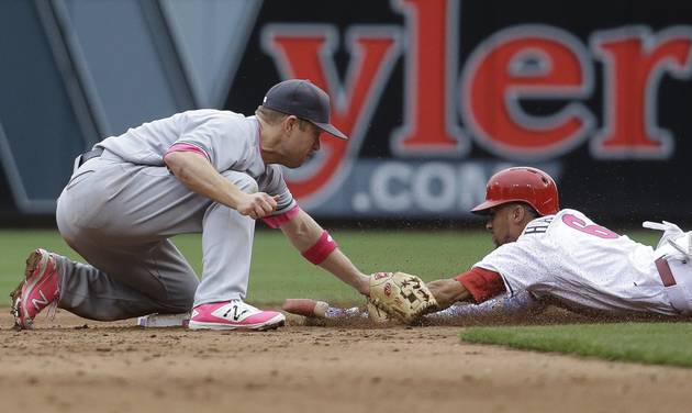 CORRECTS TO SECOND BASEMAN INSTEAD OF THIRD- Milwaukee Brewers second baseman Aaron Hill left tags out Cincinnati Reds&#039 Billy Hamilton on a steal-attempt for the final out of the ninth inning of a baseball game Sunday