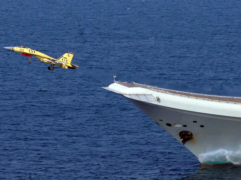 Jian-15 fighter jet takes off from China's first aircraft carrier the Liaoning during a sea trial in Qingdao in eastern China's Shandong province