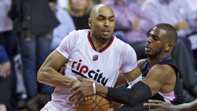 Chris Paul injured his wrist while defending Blazer guard Gerald Henderson