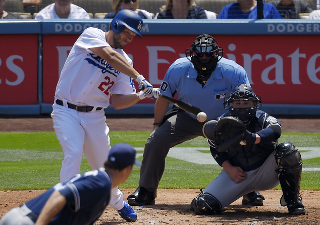 Los Angeles Dodgers Clayton Kershaw hits an RBI-single as San Diego Padres starter Drew Pomeranz lower left pitches and catcher Derek Norris right