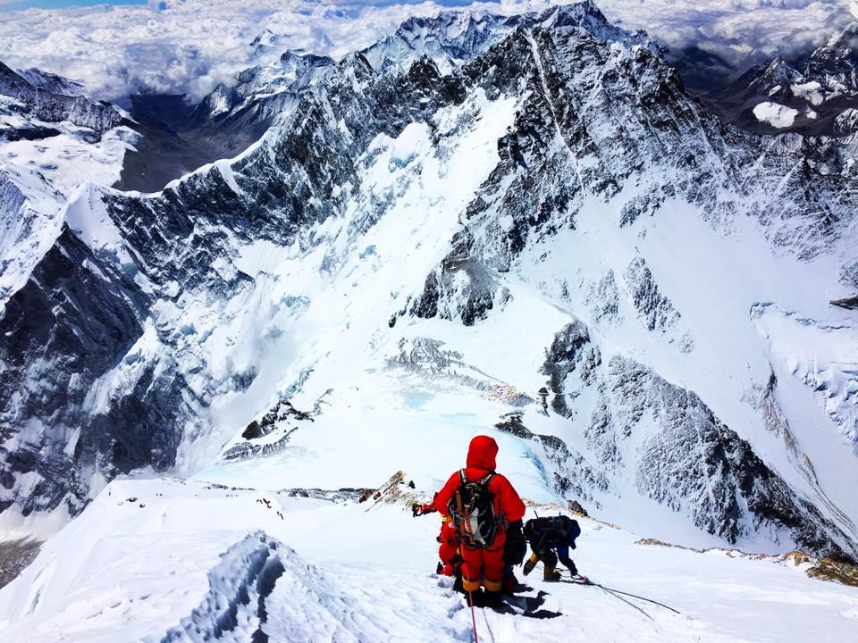 Climbers descend Mount Everest in good weather