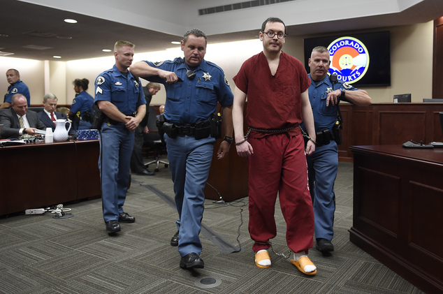 Colorado theater shooter James Holmes is led out of the courtroom after being formally sentenced in Centennial Colo