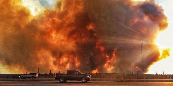 Canada wildfire raging in Alberta has spread from Fort McMurray into Saskatchewan