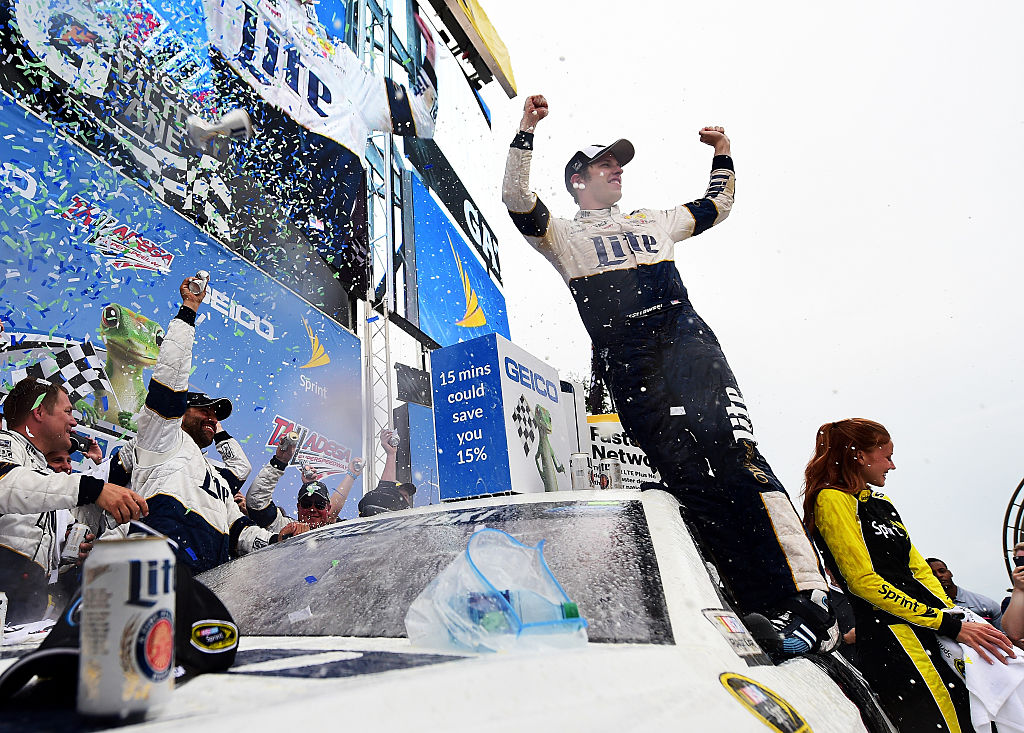 Brad Keselowski driver of the #2 Miller Lite Ford celebrates in Victory Lane after winning the NASCAR Sprint Cup Series GEICO 500 at Talladega Superspeedway