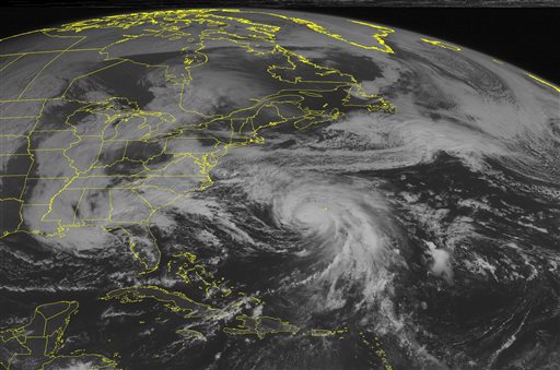 This NOAA satellite image taken Sunday Oct. 4 2015. at 9:45 AM EDT shows slowly weakening Hurricane Joaquin southwest of Bermuda moving in a north-northeast direction. A band of cloudiness to the north of Joaquin extends to the Midatlantic with rain