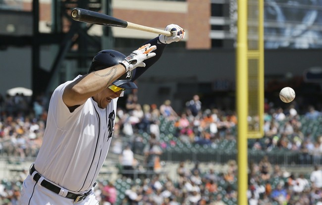 Detroit Tigers Miguel Cabrera reacts after being hit by a pitch on his left knee during the seventh inning of a baseball game against the Tampa Bay Rays Sunday