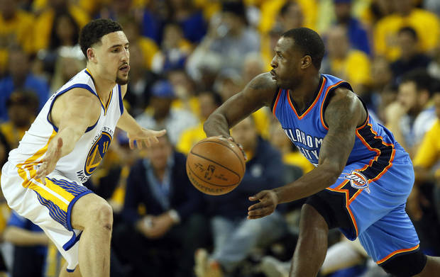 Dion Waiters tries to pass past the Warriors Klay Thompson in Game 1