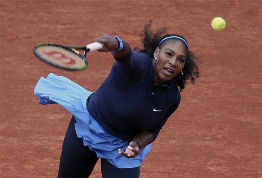 Serena Williams of the U.S. serves the ball to Slovakia's Magdalena Rybarikova during their first round of the French Open tennis tournament at the Roland Garros stadium Tuesday