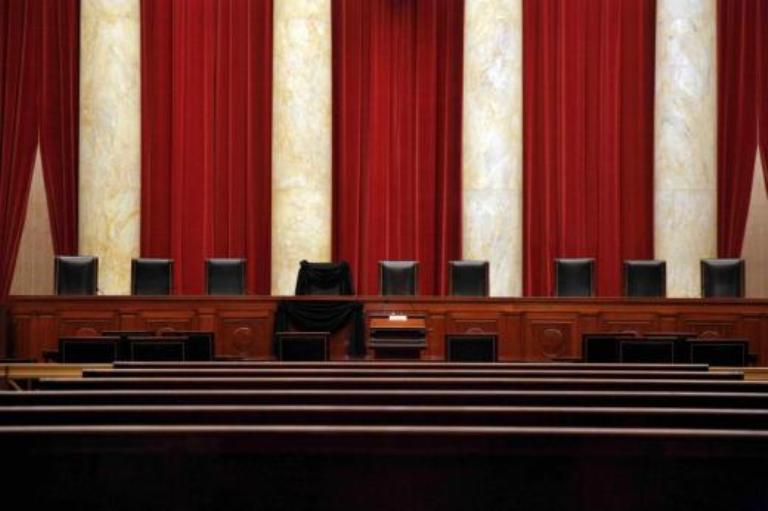 The bench of late Supreme Court Justice Antonin Scalia was draped with black wool crepe in memoriam inside the Supreme Court after his death in February 2016. Reuters