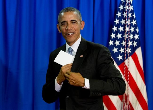 President Barack Obama leaves the podium after a news conference at the Shima Kanko Hotel in Shima Japan Thursday