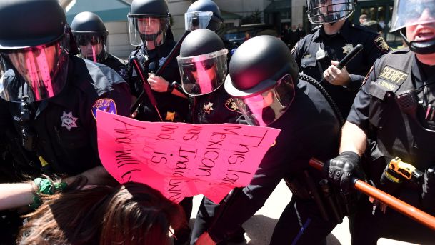 Police in riot gear hold back demonstrators against U.S. Republican presidential candidate Donald Trump outside the Hyatt hotel where Trump is set to speak at the California GOP convention in Burlingame California U.S