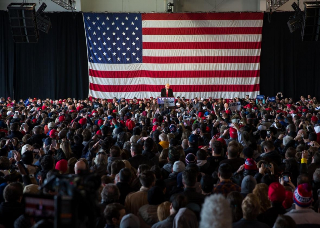 Donald Trump speaks in front of a capacity crowd at a rally for his campaign