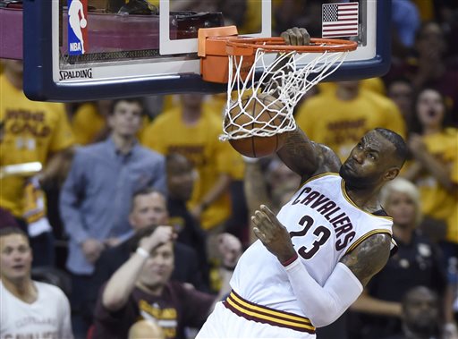 Cleveland Cavaliers forward Le Bron James dunks against the Toronto Raptors during the first half of Game 5 of the NBA basketball Eastern Conference finals Wednesday