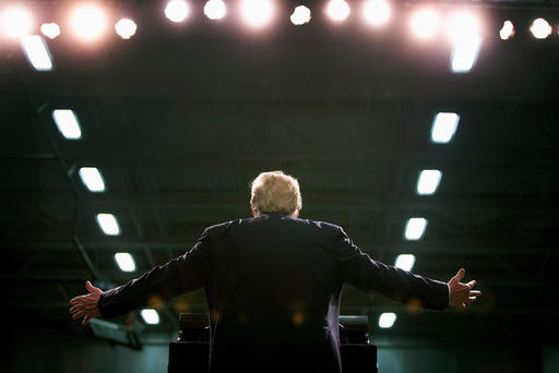 Republican presidential candidate Donald Trump speaks to guests during a rally at Macomb Community College