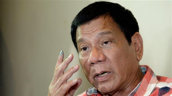 Philippines Presidential frontrunner and Davao City Mayor Rodrigo Duterte gestures as he is interviewed by reporters at a hotel in Davao City on the southern island of Mindanao