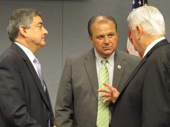 Jay Dardenne left House Speaker Taylor Barras center and Senate President John Alario speak ahead of a meeting of the state's income forecasting panel on Thursday